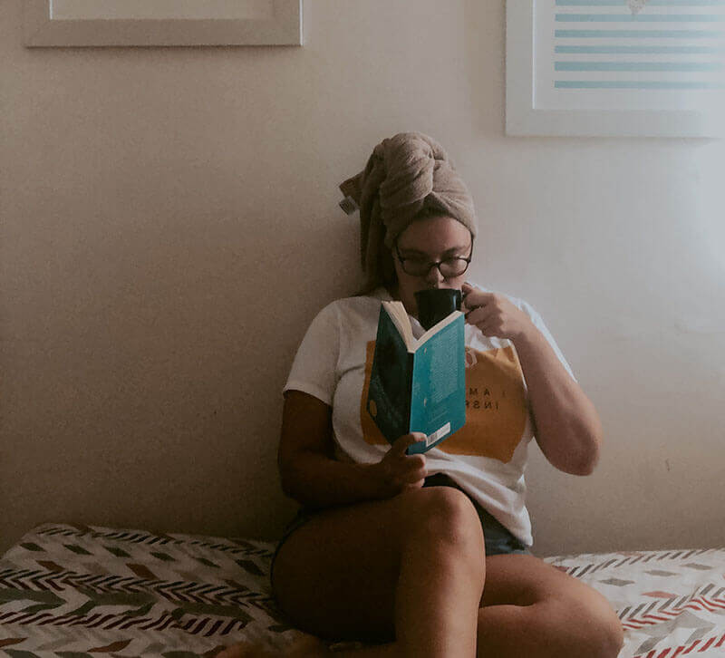 Woman Reading & Drinking Tea after Hot Shower